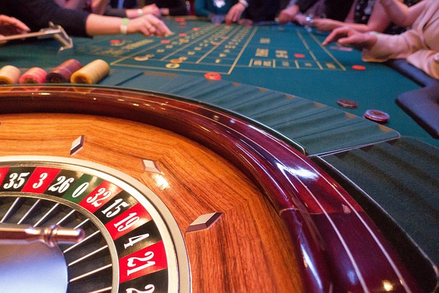 Roulette table with players betting